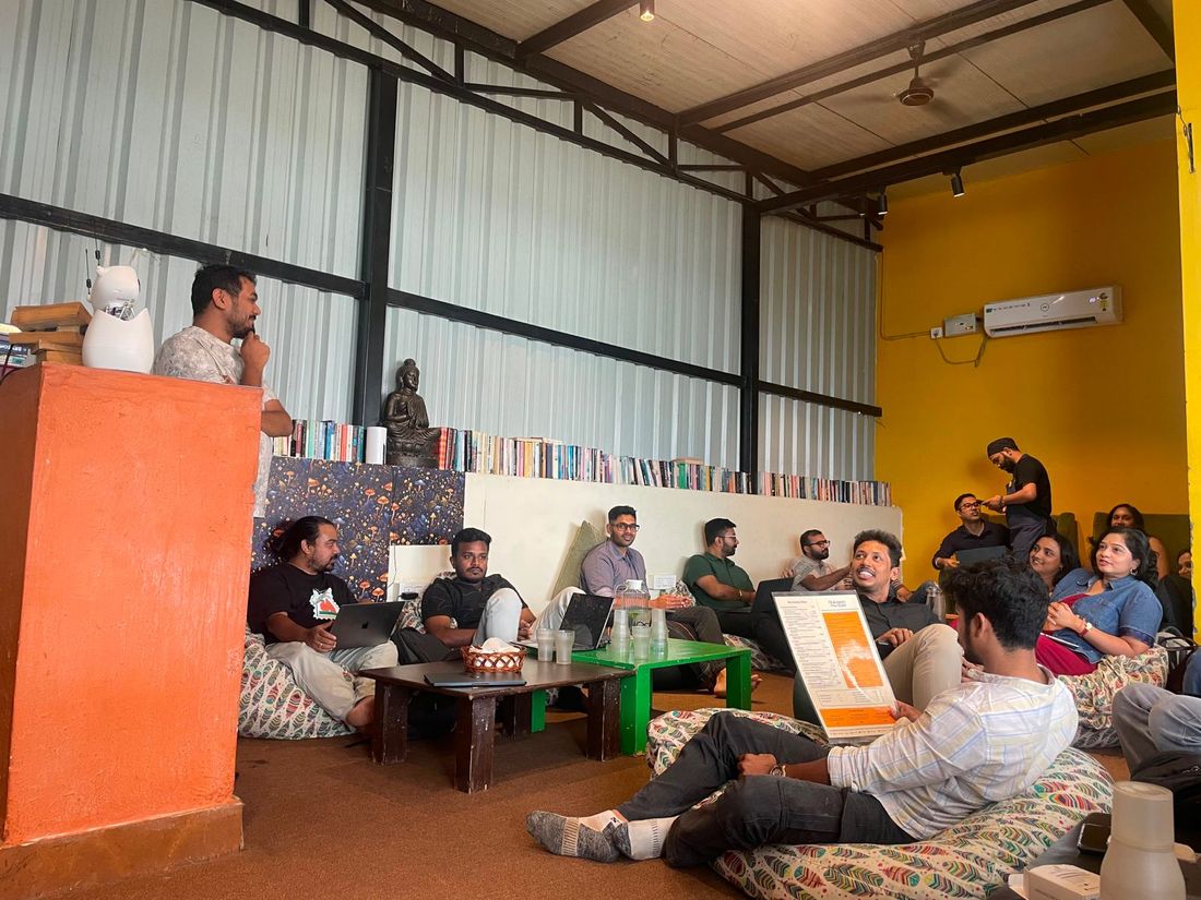 Someone sharing to the room while everyone listens from the floor